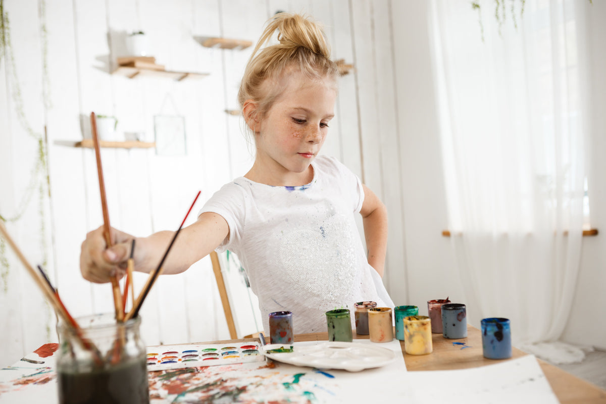 Painting with tempera paints — tubes and jars of tempera paints ready to use