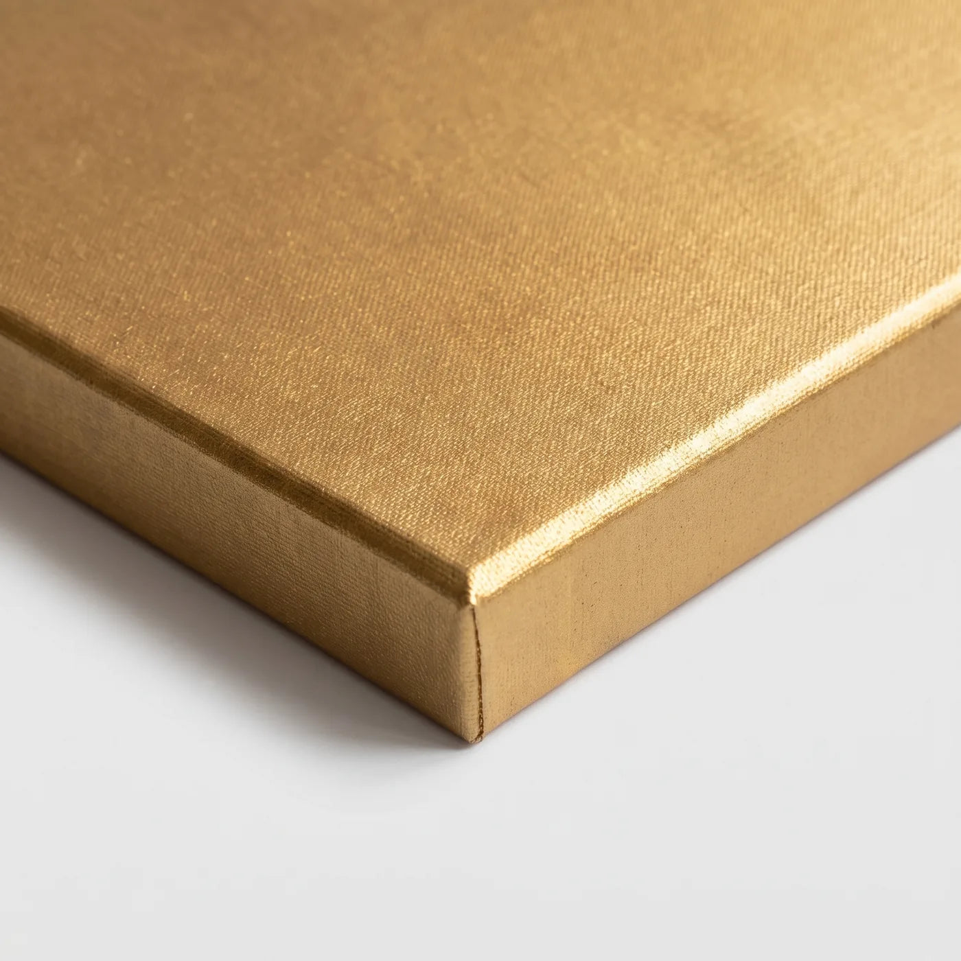 Front corner of the MIDAS gold canvas — pigment also covers the side