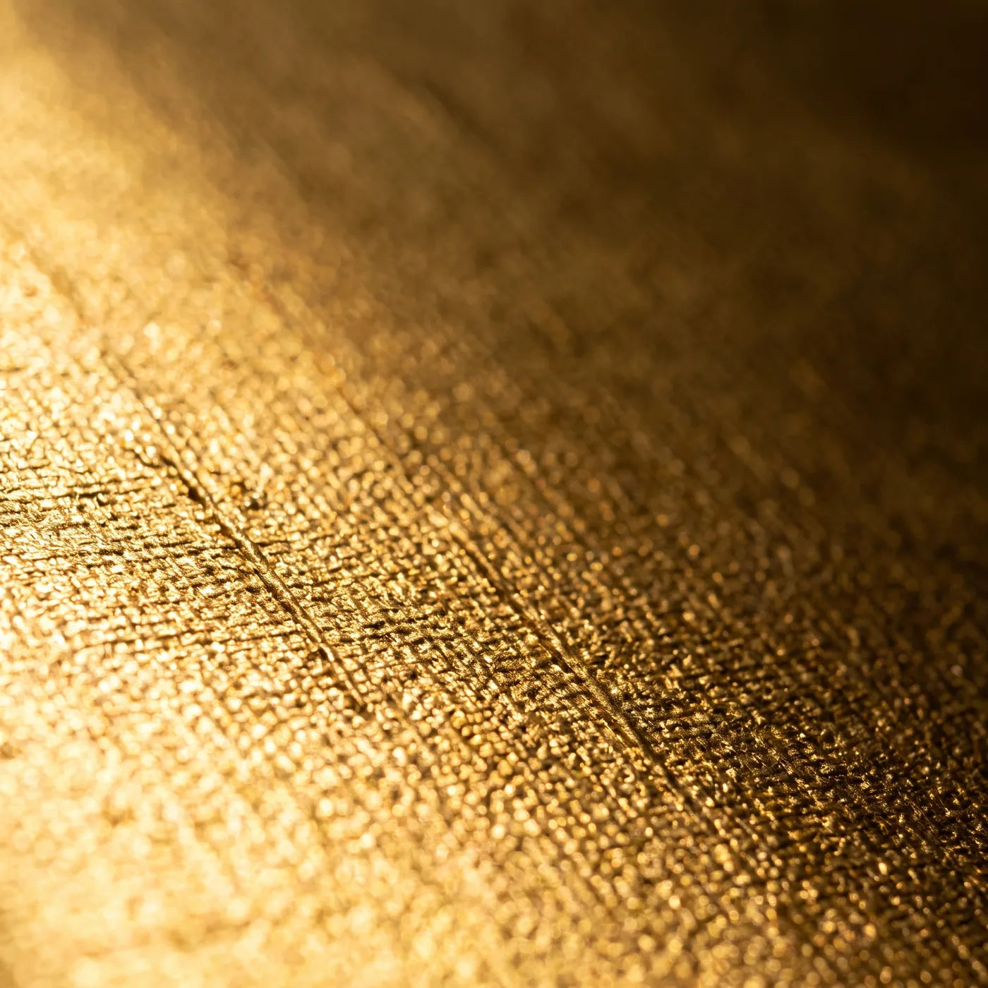 Close-up of the cotton weave visible beneath the gold coating on a MIDAS canvas